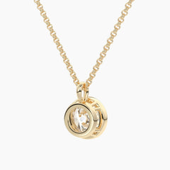 Gold moissanite pendant necklace with round brilliant stone in bezel setting on chain