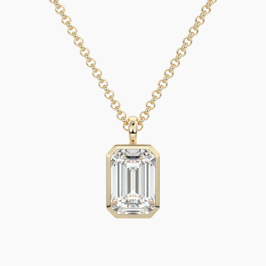 Emerald cut moissanite pendant necklace in yellow gold setting on a chain