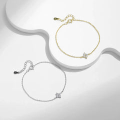 Gold and silver moissanite star bracelets with minimalist chain on white background