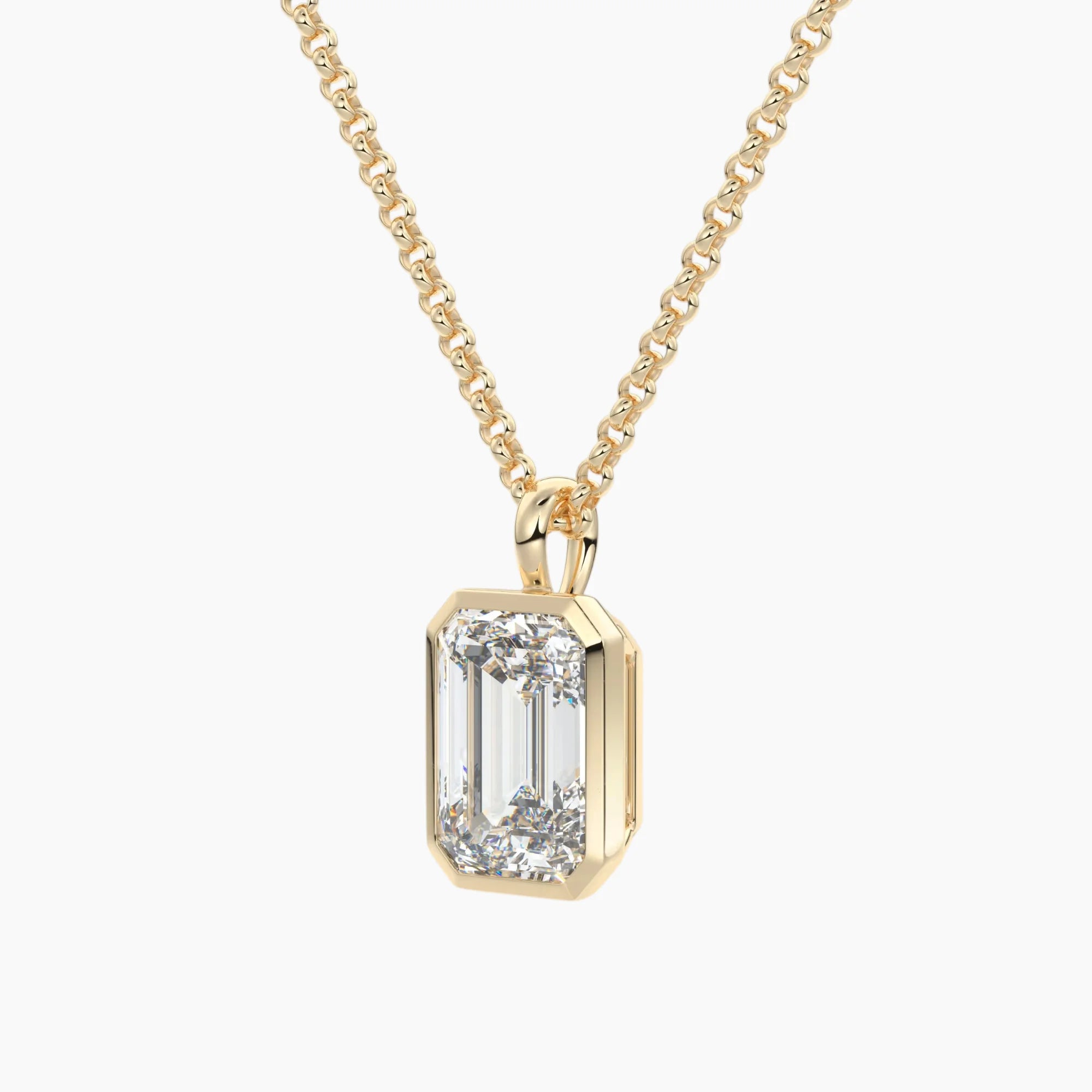 Gold chain necklace with emerald-cut moissanite pendant in solitaire setting