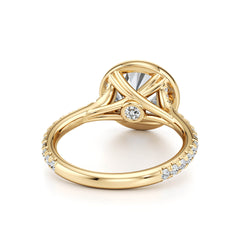Yellow gold moissanite engagement ring with round center stone and pavé band
