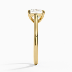 Side view of a gold ring with a rectangular moissanite center stone