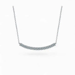Moissanite bar pendant necklace with silver chain on white background