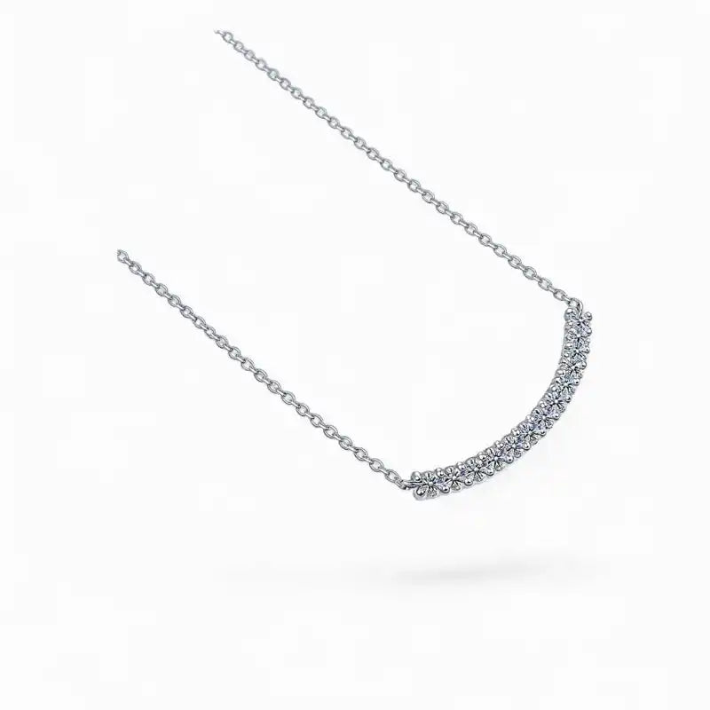 Moissanite curved bar necklace with round gemstones on a delicate silver chain