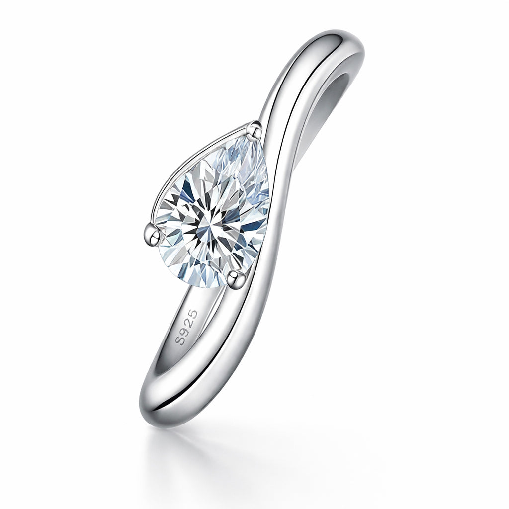 Sterling silver ring with pear-shaped moissanite stone, minimalist jewelry design