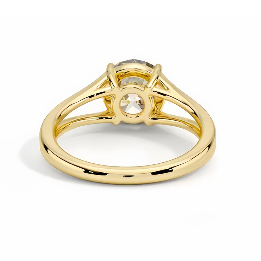 Yellow gold solitaire ring with round moissanite gemstone in prong setting