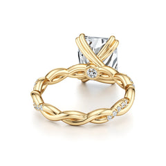 Gold twisted band engagement ring with moissanite center stone and small accent stones