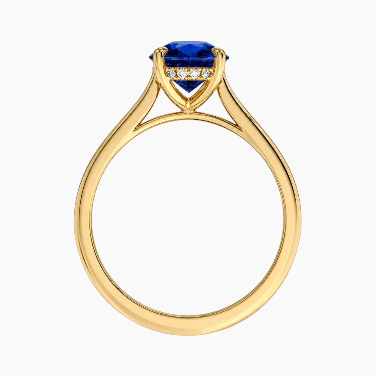 Front view of an 18K gold-plated ring highlighting the basket setting, hidden halo, and a vibrant 2-carat oval lab-grown blue sapphire