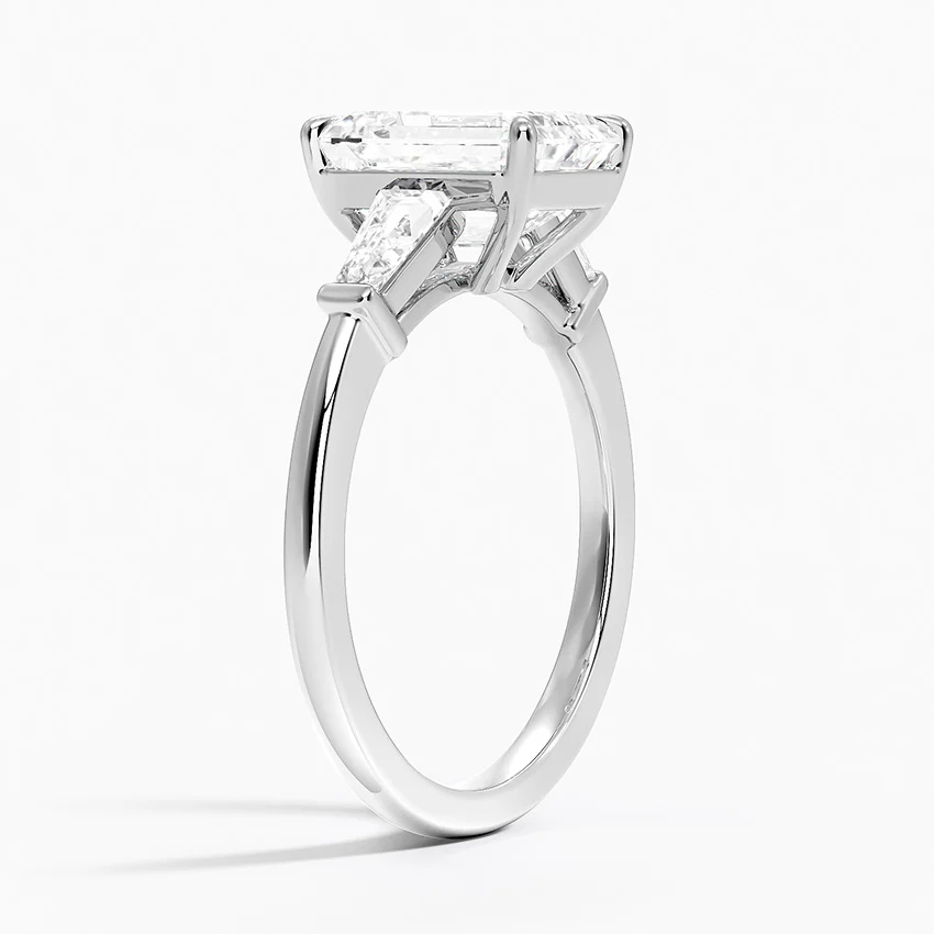 Elegant moissanite engagement ring with a large rectangular stone on a silver band