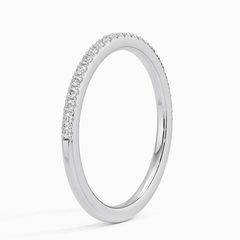 Slim silver moissanite eternity band with pavé-set stones on a white background