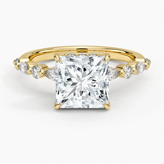 Princess cut moissanite engagement ring with gold band and side stones