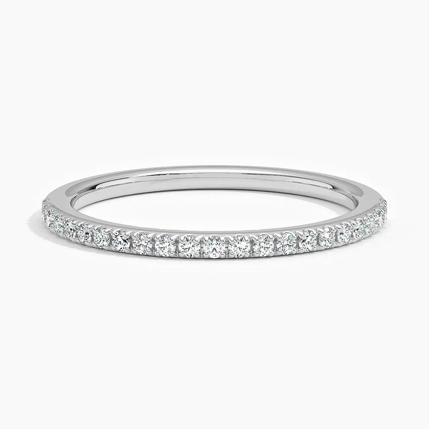 Thin moissanite eternity band in white gold with pavé set round gemstones