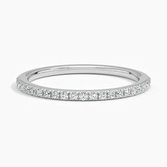 Thin moissanite eternity band in white gold with pavé set round gemstones