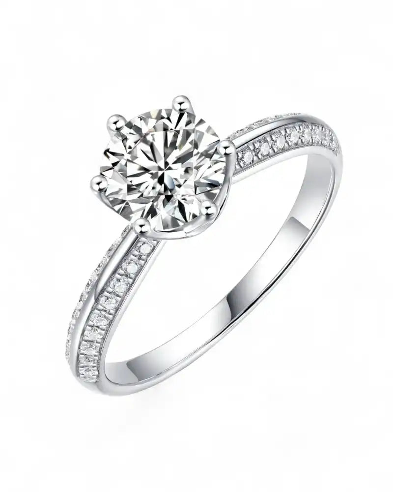 Solitaire moissanite engagement ring with pavé band in white metal