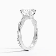 Moissanite engagement ring with pave band in white gold on white background