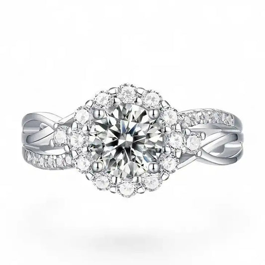 Halo moissanite engagement ring with round center stone and pavé diamond-like accents on silver band