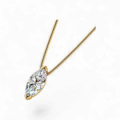 Gold necklace with marquise cut moissanite pendant on white background