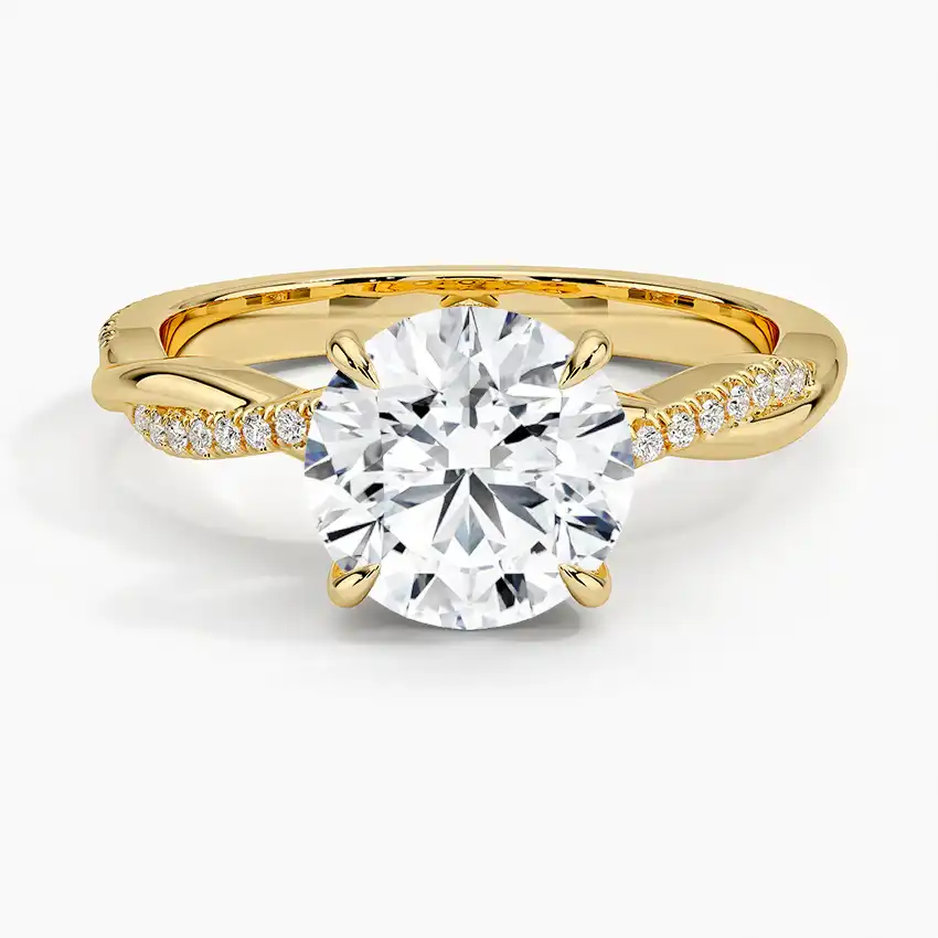 Yellow gold moissanite engagement ring with round brilliant center stone and pavé band