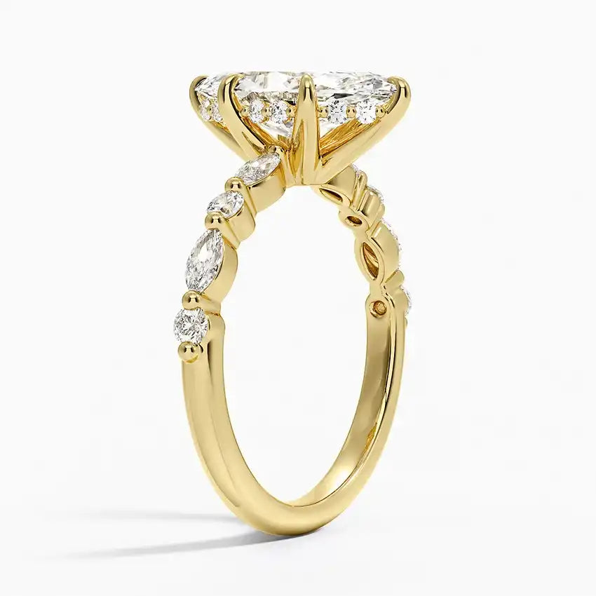 Gold moissanite engagement ring with marquise and round-cut stones on band