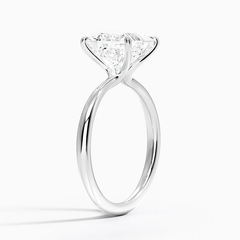 Solitaire moissanite engagement ring with a round brilliant stone in a prong setting