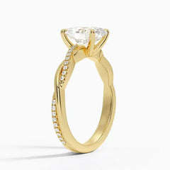 Gold moissanite engagement ring with pavé side stones and twisted band design