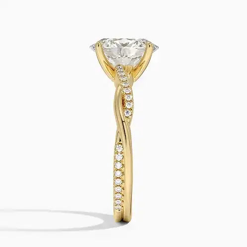 Gold twisted band ring with large moissanite center stone and pavé accents, side view