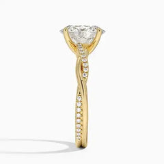 Gold twisted band ring with large moissanite center stone and pavé accents, side view
