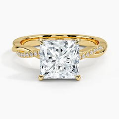 Princess cut moissanite engagement ring with gold band and pavé accent stones