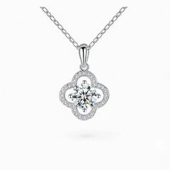 Moissanite flower pendant necklace in white gold with round center stone and pavé accents