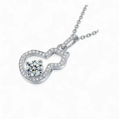 Sterling silver pendant necklace with a round moissanite center stone and pavé accents