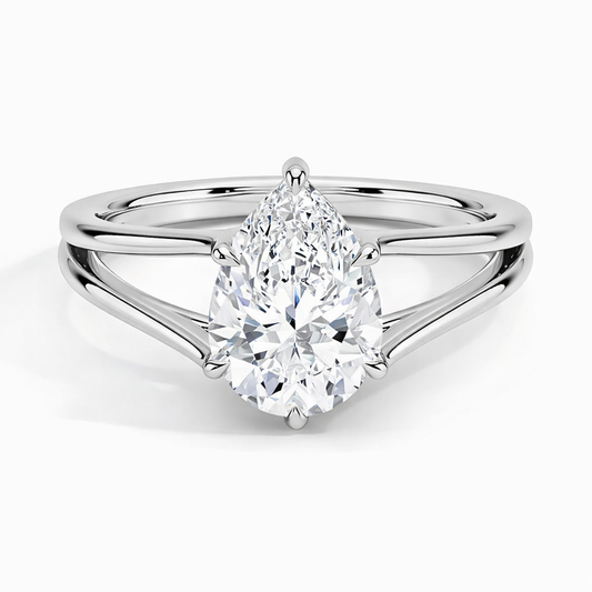 Pear-shaped moissanite solitaire ring with split shank in polished silver setting