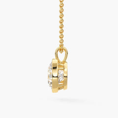 Gold chain necklace with round moissanite solitaire pendant, side view, white background