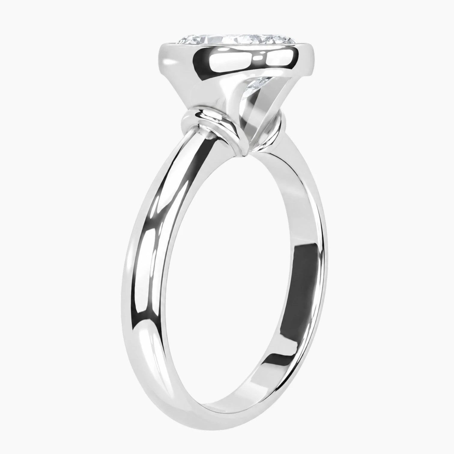 Side profile of a bezel set round moissanite ring highlighting the protective setting and 2.6mm band