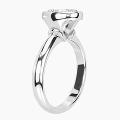 Side profile of a bezel set round moissanite ring highlighting the protective setting and 2.6mm band