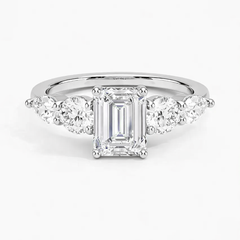 Emerald cut moissanite engagement ring with side stones in white gold setting