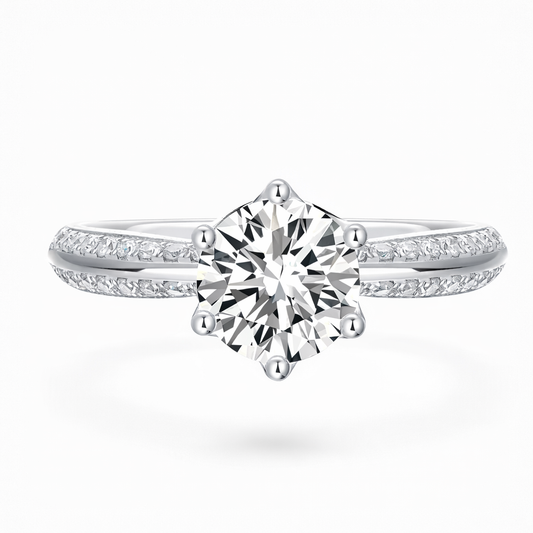 Round cut moissanite engagement ring with pavé band in white gold setting