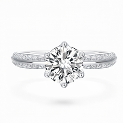 Round cut moissanite engagement ring with pavé band in white gold setting
