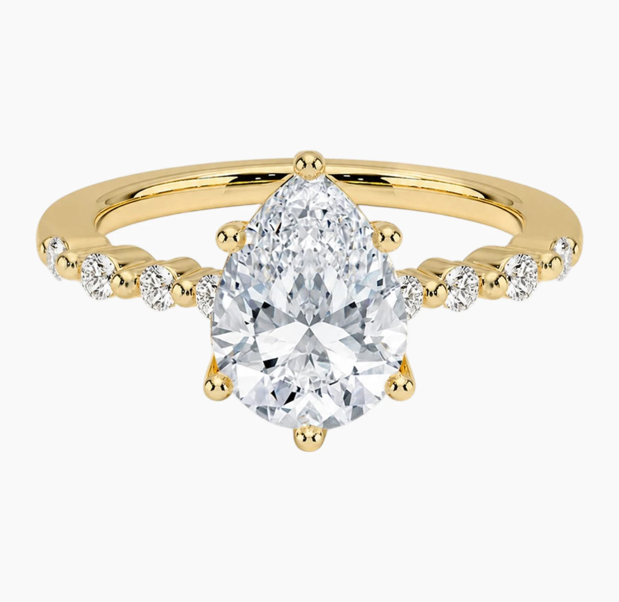 Pear-cut moissanite ring featuring an 18K white gold-plated band set with pavé diamonds; an elegant solitaire-style engagement ring.