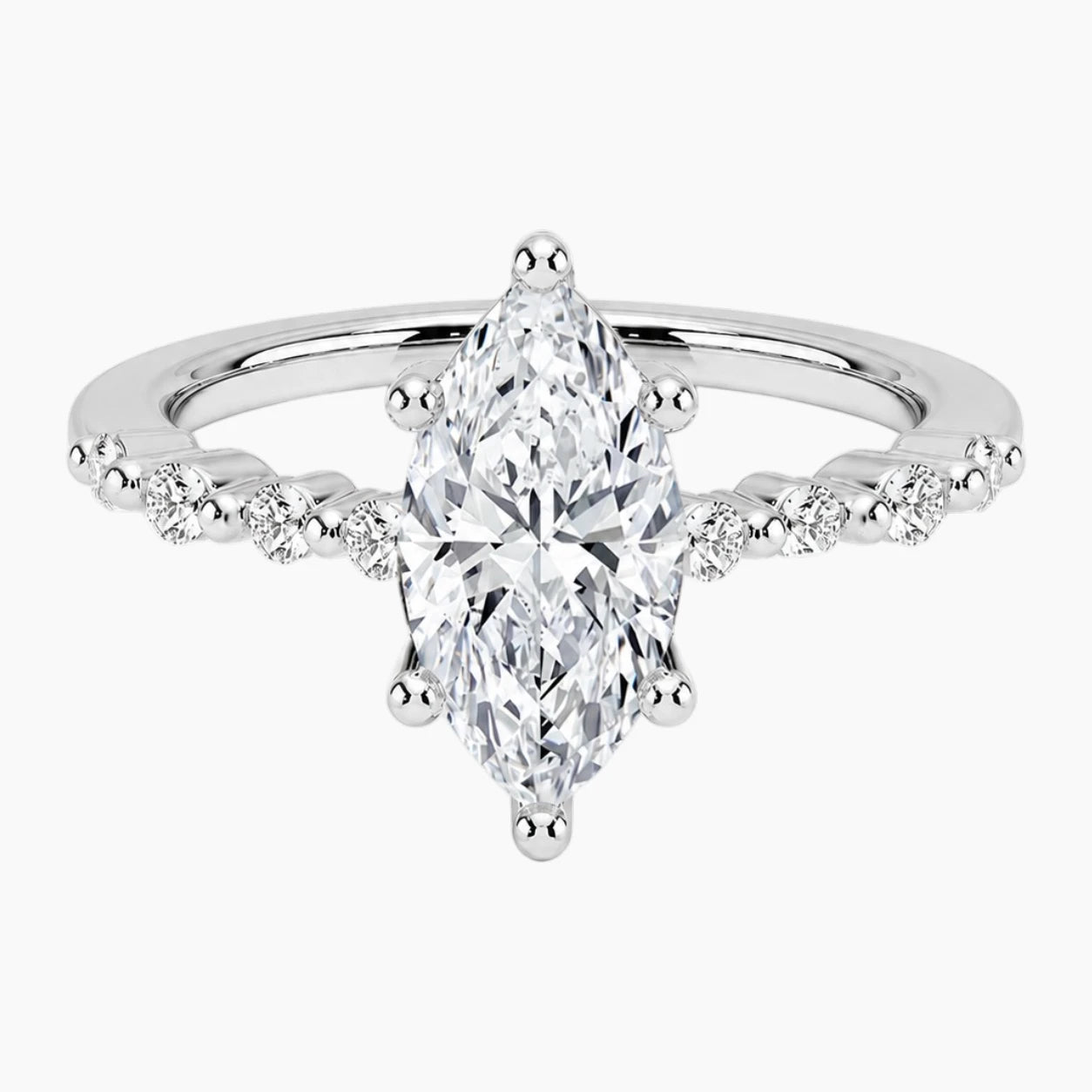 Marquise-cut moissanite ring featuring an 18K white gold-plated band set with pavé diamonds; an elegant solitaire-style engagement ring.