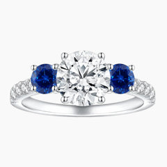 Midnight Sky Three-Stone Moissanite Ring with Blue Sapphire Accents