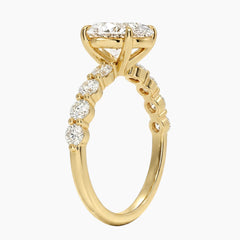 Oval-cut moissanite ring featuring an 18K white gold-plated band set with pavé diamonds; an elegant solitaire-style engagement ring.