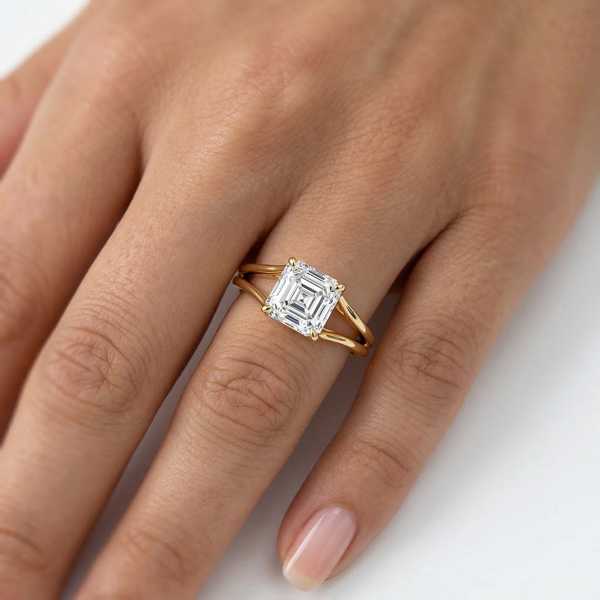 Asscher cut moissanite gold engagement ring on hand, ethical luxury jewelry