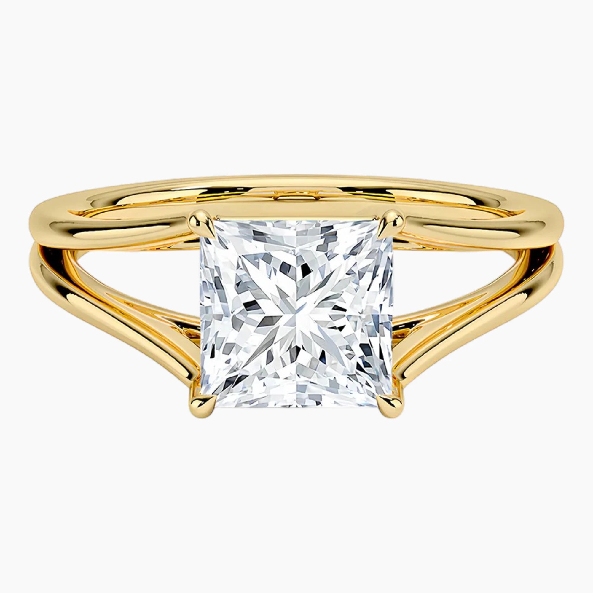 Princess cut moissanite engagement ring with split shank yellow gold band