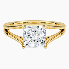 Princess cut moissanite engagement ring with split shank yellow gold band