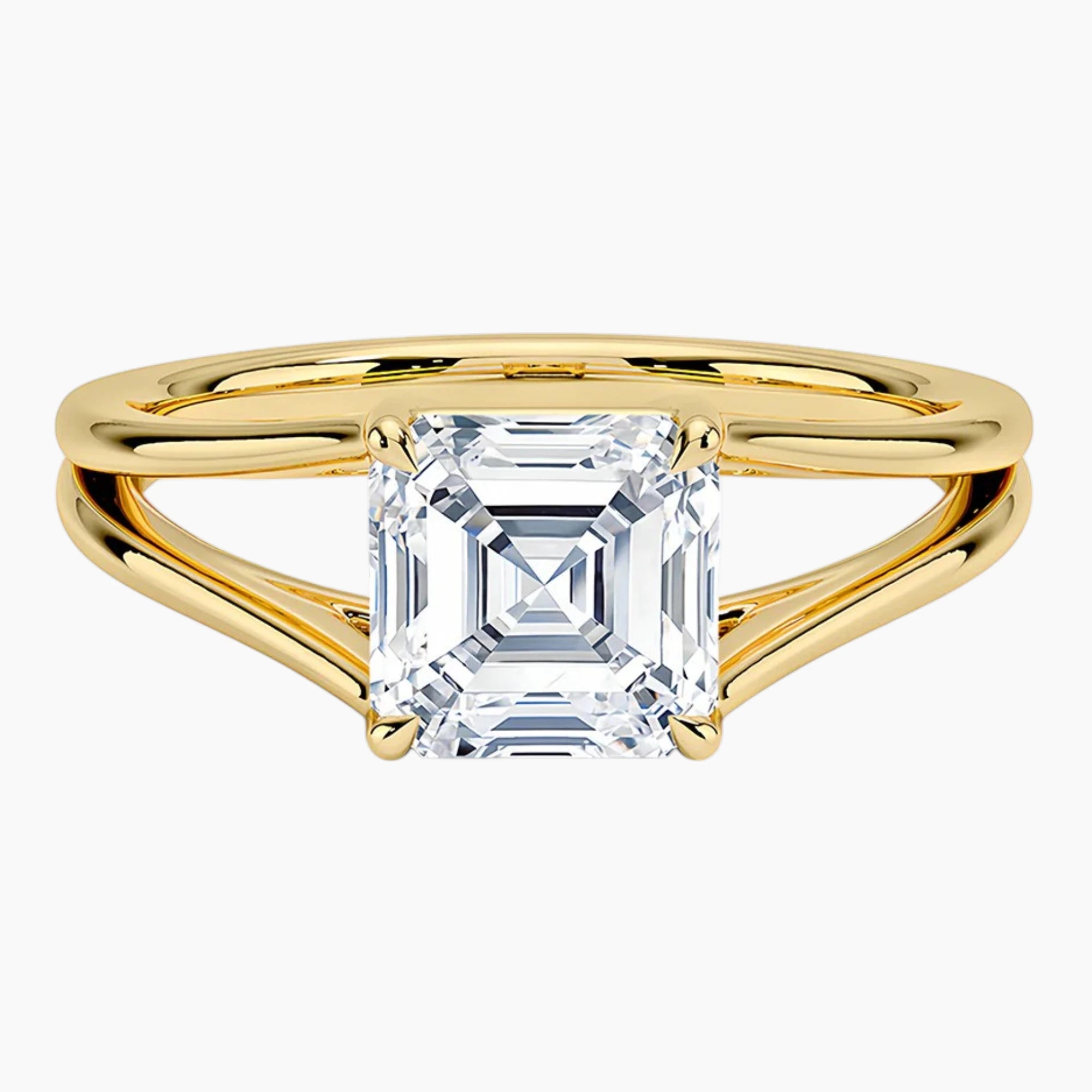 Asscher cut moissanite solitaire ring with split shank yellow gold band