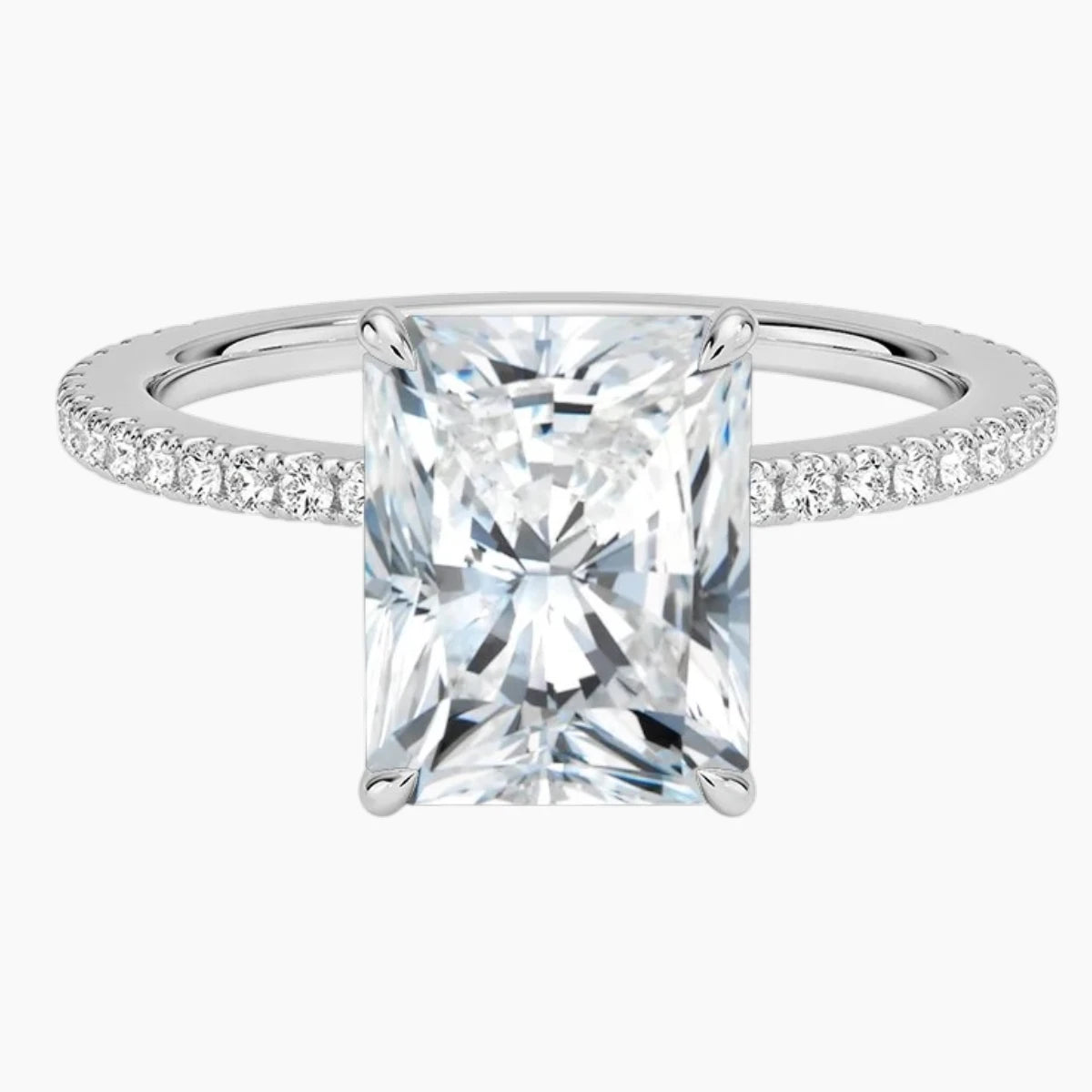 Radiant cut moissanite engagement ring with pavé band in white silver