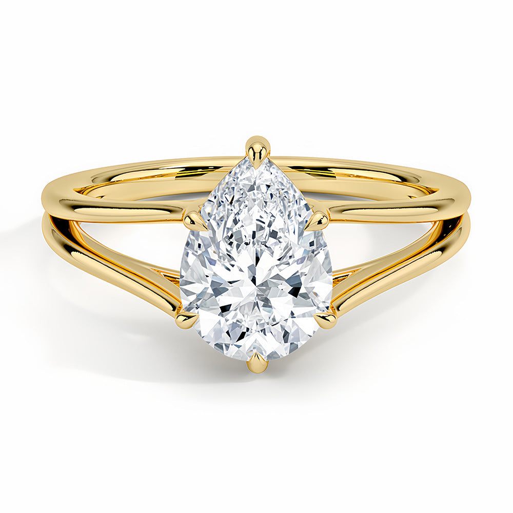 Pear-shaped moissanite solitaire ring with split gold band on white background