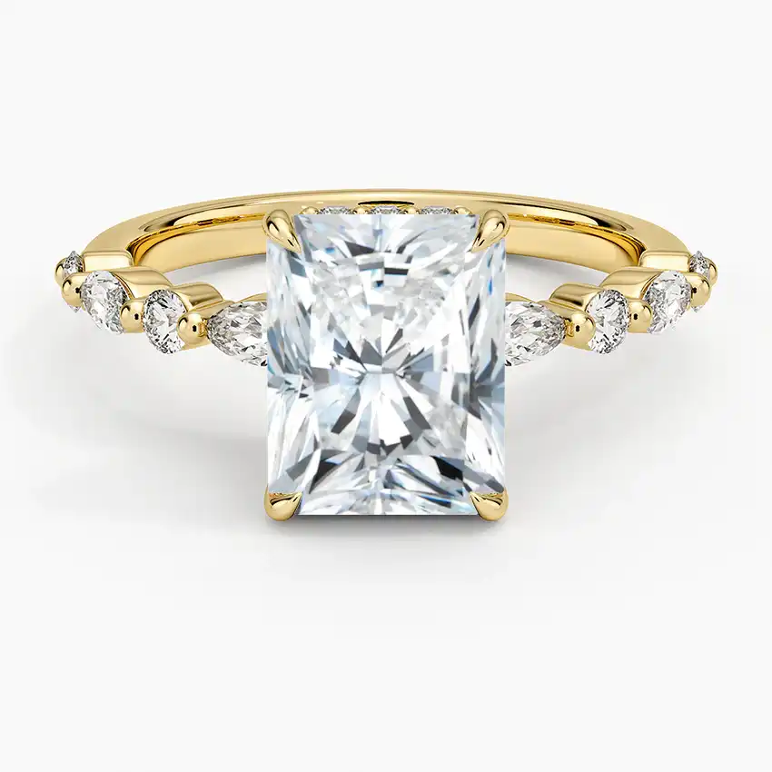 Radiant cut moissanite engagement ring with gold band and side accent stones