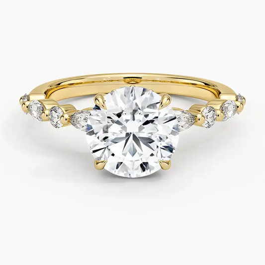 Round moissanite engagement ring with side stones on yellow gold band