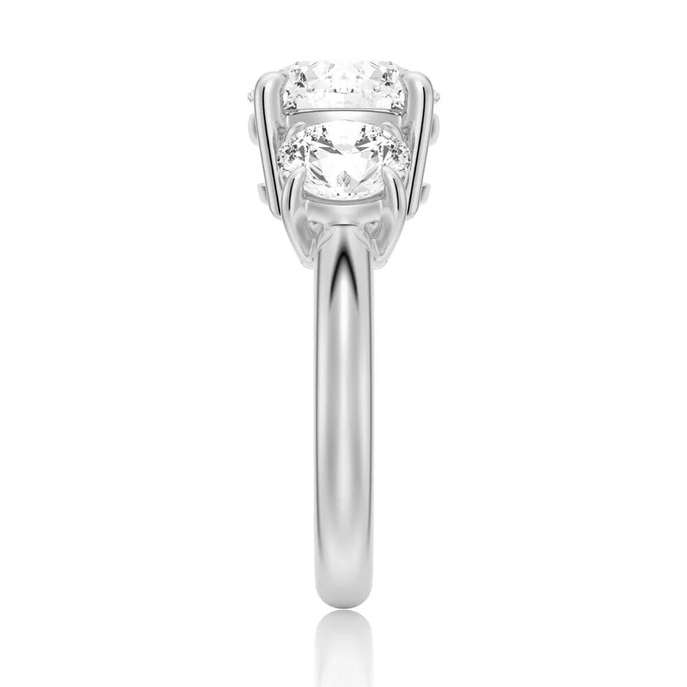 Side view of a silver moissanite engagement ring with round brilliant stones